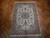 6'7" x 9'6" Persian Tabriz rug on herringbone parquet floor showing full ivory and pink design