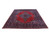 10'3 x 12'7 Mashad rug displayed at an angle on a light floor, dark floral border visible
