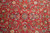 Close up of hand-knotted wool pile with palmettes, boteh paisleys and ivory blossoms