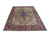 Angled view of 8'3" x 10'11" hand-knotted Tabriz rug showing green field and red border