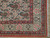 Corner detail with ivory floral border, rose vases, salmon guard stripes and clean ivory fringe