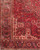 Corner detail showing ivory spandrel, navy turtle palmette border and narrow floral guard stripes