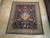 8'3" x 9'6" Tabriz Persian rug displayed on light wood floor showing full hunting design