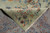 Folded corner revealing the hand-knotted back, cotton foundation and even knotting of this Persian rug