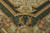 Corner detail showing deep green lattice border, acanthus scrolls and beaded gold guard stripes