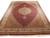 Full view of 6'7" x 10'3" Persian Tabriz Mahi rug with ruby red field and ivory medallion