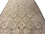 Lengthwise perspective of the 9'8" x 14'2" Aubusson rug revealing overlapping plate medallions and rose sprays