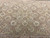 Center field detail with round medallion, scrolling ribbons and delicate rose bouquets in soft sage