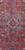 Close-up of royal blue lobed medallion with ivory rosettes and pendant on deep red ground