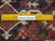 Ruler on back of 10'2 x 12'9 Heriz rug showing hand-knotted wool knots per square inch