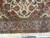 End pendant palmette, brick spandrel and blush main border photographed beside the ivory fringe, fine wool pile