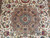 Detailed 8 petal rosette medallion with turquoise center, red star and pink petals on ivory field