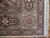 Corner detail of cartouche border, barber pole guard stripe and ivory cotton fringe