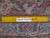 Back of the 10x16 Mahal rug with ruler confirming hand-knotted wool weave and knot density