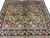 7'3" x 8'2" Oriental rug at an angle showing layered floral borders and black field