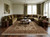 Living room with olive velvet sectional, walnut coffee table and cream Soltanabad wool rug