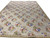 Wide angled view of the 10' x 14' floral needlepoint rug suited to a large living room