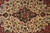 Detail of the lobed medallion centered in mirrored floral drawing on ivory wool ground