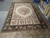 Warehouse floor view of the French Aubusson design rug tagged S10-4089 in 12 x 18