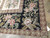 Corner detail of cream and pink blooms on black with dusty rose wave guard