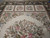 End panels with 4 square floral cameos above the central bouquet on ivory ground