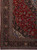 Oversize 10x14 Kashan corner detail with multi-stripe navy border and ivory spandrel vinery