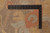 Carpenter square ruler laid across the pile showing 10x14 Oushak rug knots per square inch