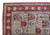 Corner detail of palmette border, oval cartouches and arched panels with ivory fringe edge