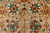 Close up of hand-spun Ghazni wool pile with teal, rust and gold palmettes, natural abrash