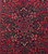 Close-up of the dark slate blue pole medallion with pink and ivory blossoms on wool pile