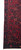 Corner and fringe detail showing the navy main border, zigzag guard stripe and tight selvage edge