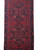 4'11" x 13'7" Hamedan runner section with all-over floral field framed by twin navy borders