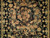 Close-up of hand-knotted wool pile with peach tulips, gold peonies and sage leaves on black