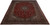 Angled floor view of the 10x13 signed Kashan rug showing navy border and ruby red field