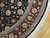 Border detail showing burgundy floral band, slate blue guard stripes and hand-tied ivory fringe