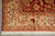 Border corner resolution with vase motifs, red flowers and neat selvage on gray floor