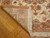 Back of the 3' x 10' Tabriz runner folded showing tight knotting and cotton foundation