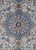 Close-up of navy 8 petal medallion with ivory palmettes and gold rosettes on pale green ground