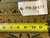 Inventory tag PIX-18473 and tape measure resting on the rug border showing knot detail