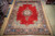 9'10" x 13'3" Sarouk rug laid flat on wood floor showing full medallion layout