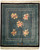 7'10" x 8'8" Chinese green wool rug with black border, floral sprays and carved fretwork