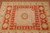 Close view of the gold octagonal medallion and open ivory center field detail