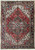 Red field Persian Heriz rug showing geometric star medallion, ivory corner spandrels and navy border