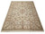 9 x 12 Chinese Tabriz design rug photographed at an angle with cream fringe and ivory ground