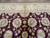9' x 11'9" Oriental rug end detail with ivory palmette border above the burgundy floral field