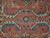 Close-up of wool pile showing ivory palmettes, navy serrated leaves and small central rosette