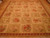 9' x 12' Chinese needlepoint rug displayed on parquet floor showing full floral grid design