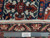 Ruler against the fringe confirming authentic handmade weave, knot density and cotton foundation of this Persian rug