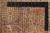 Back of the wool rug with ruler showing knot rows and cotton foundation weave