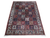 Multi-color Persian Bakhtiari garden panel rug with ivory floral border shown flat on white studio background